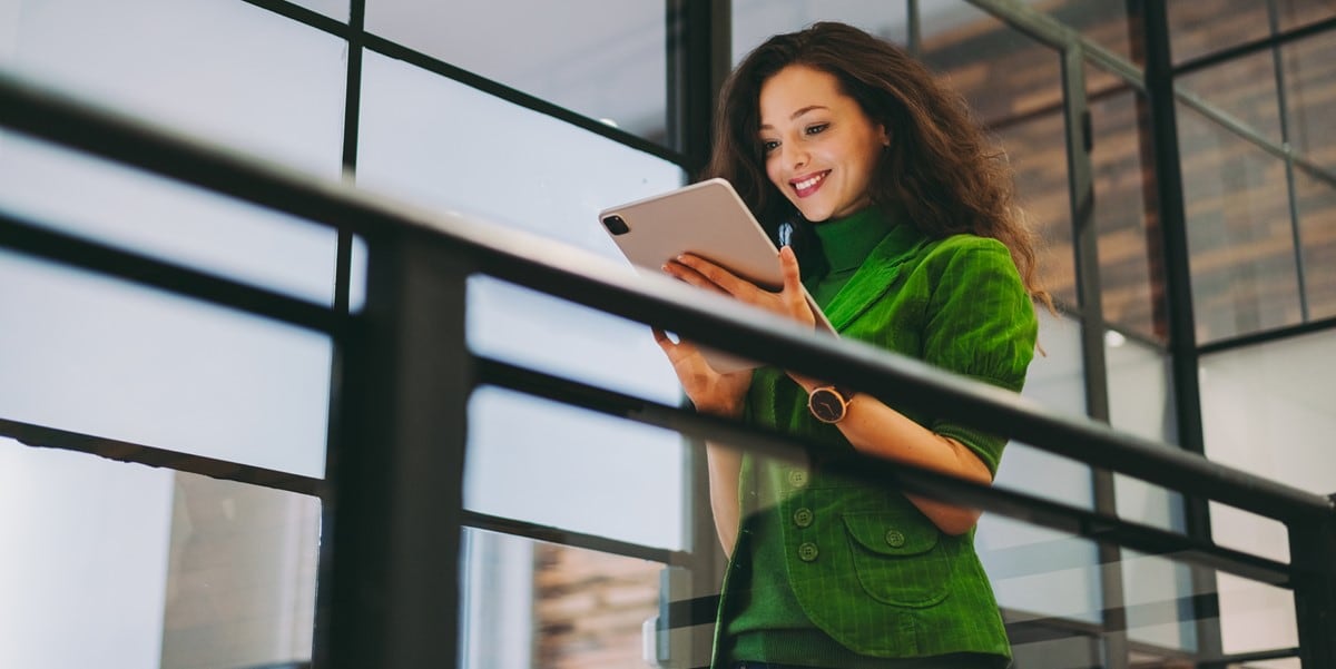 woman in office looking at phone