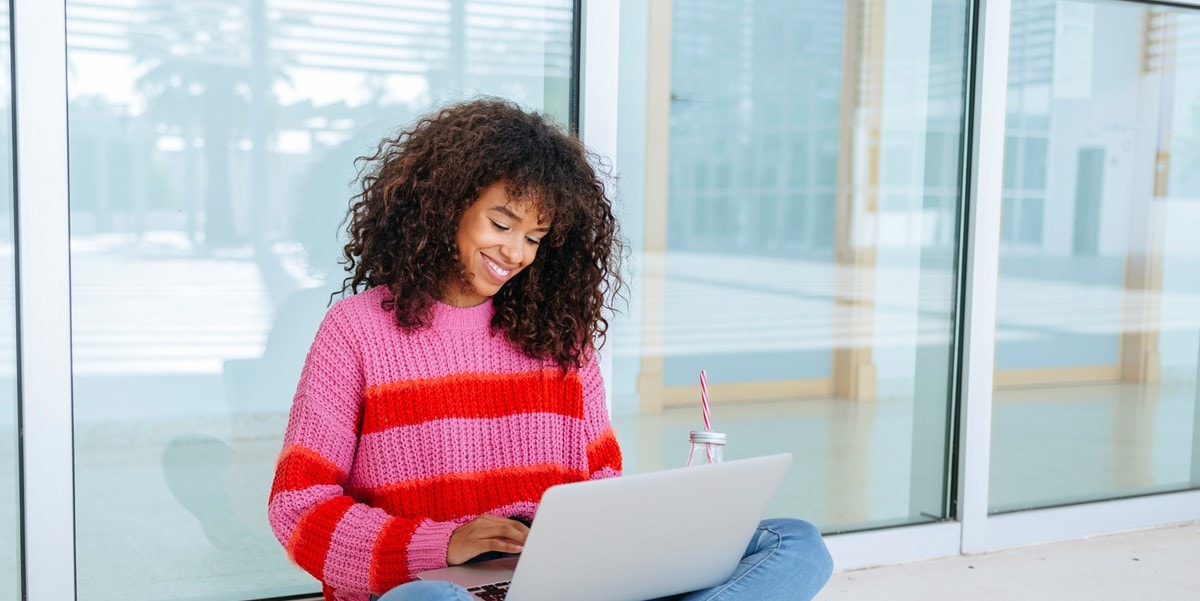 woman sitting using laptop